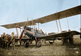 A BE2 biplane on the ground during the 1919 Second Peace Loan Tour, colourised from a period photograph. The aircraft serial C6990 was identified in the wreckage of the Mildura crash on 12 December 1919.
